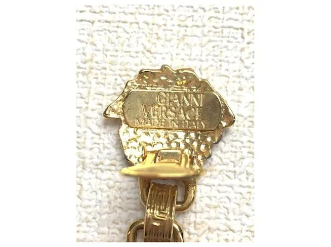 *Pendientes de oro de Gianni Versace Gold hardware 